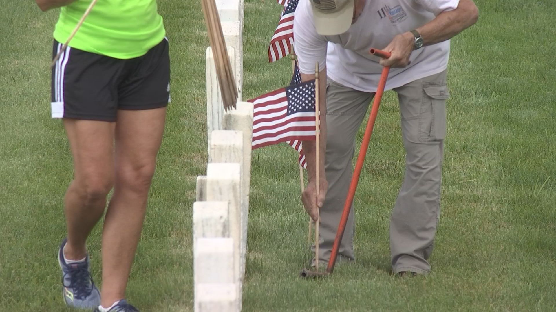 volunteers setting out flags
